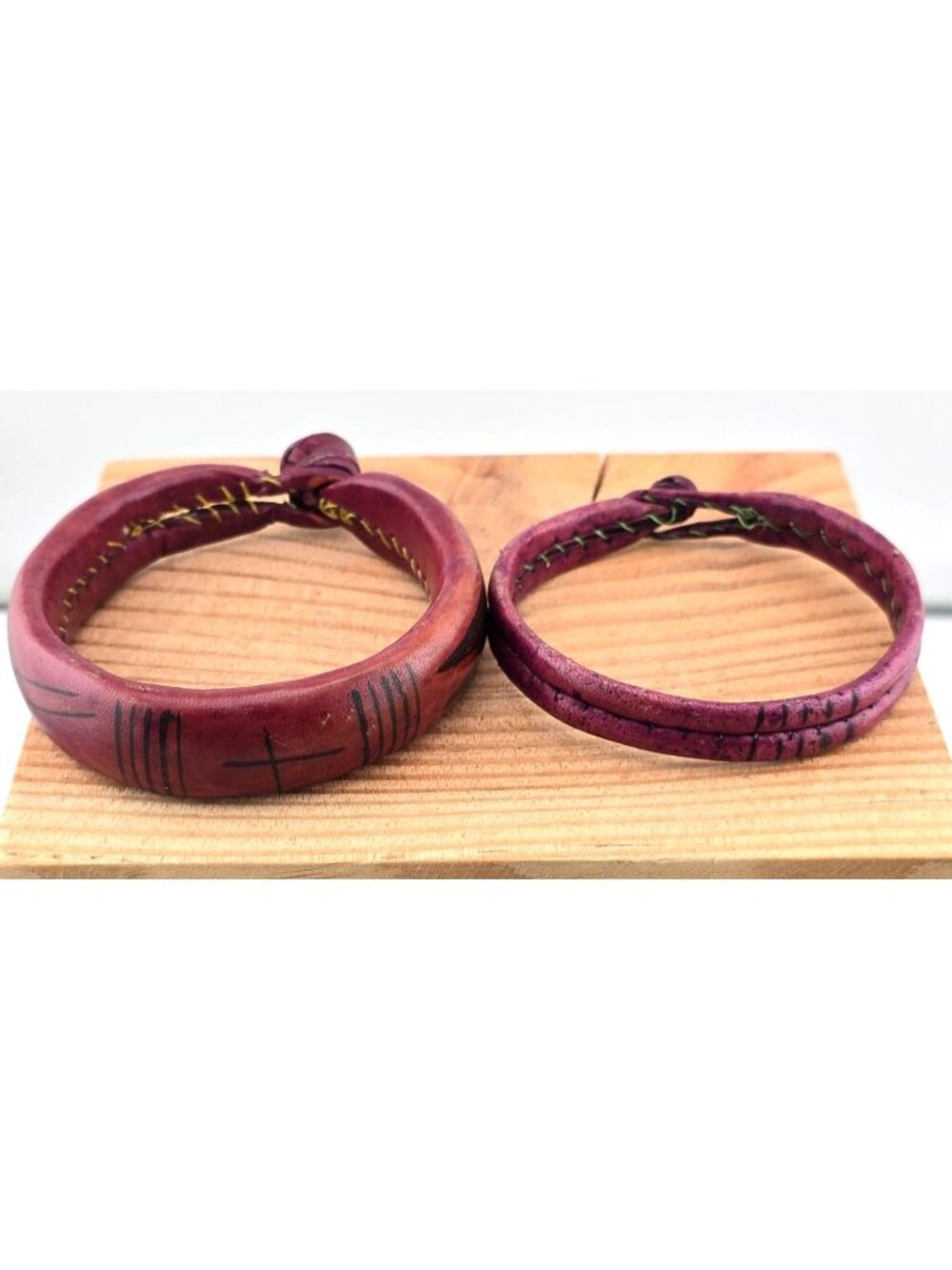 2 Handcrafted Red Leather Bracelets With Black Tribal Engravings 6.75"